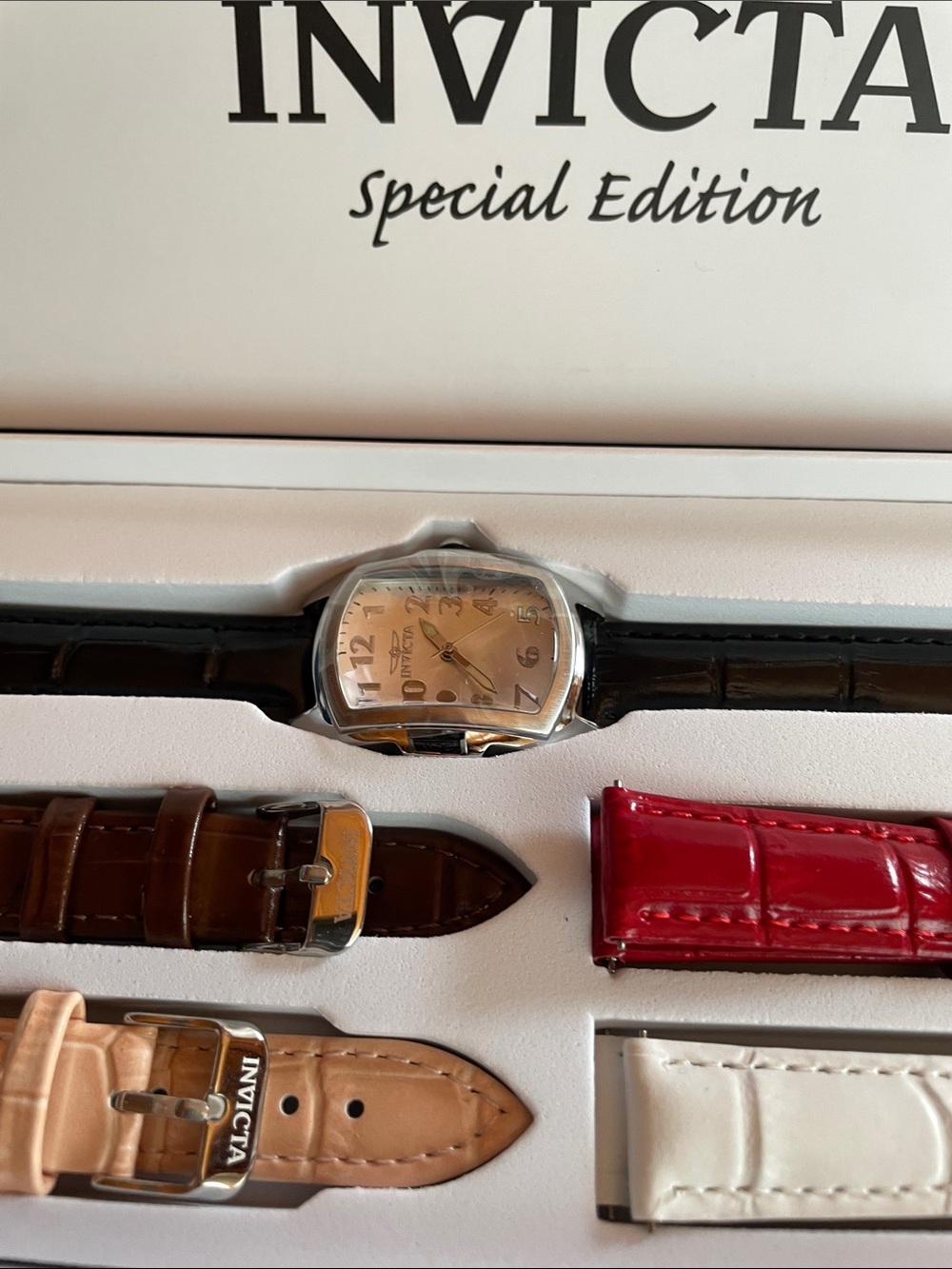 Invicta Watch with Silver Dial and Multiple Colored Straps